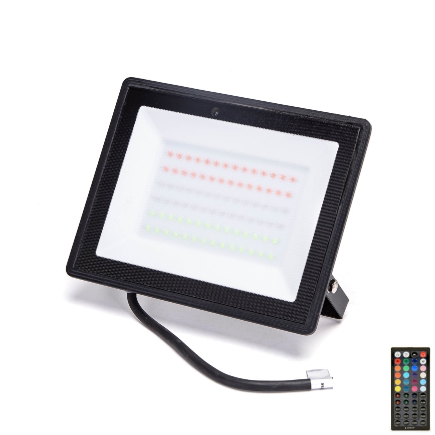 LED reflektor svieti na bielom pozadí. Je čiernej farby, obdĺžnikového tvaru a obsahuje červené a zelené diódy. Pripojený je kábel s viditeľnými drôtmi.