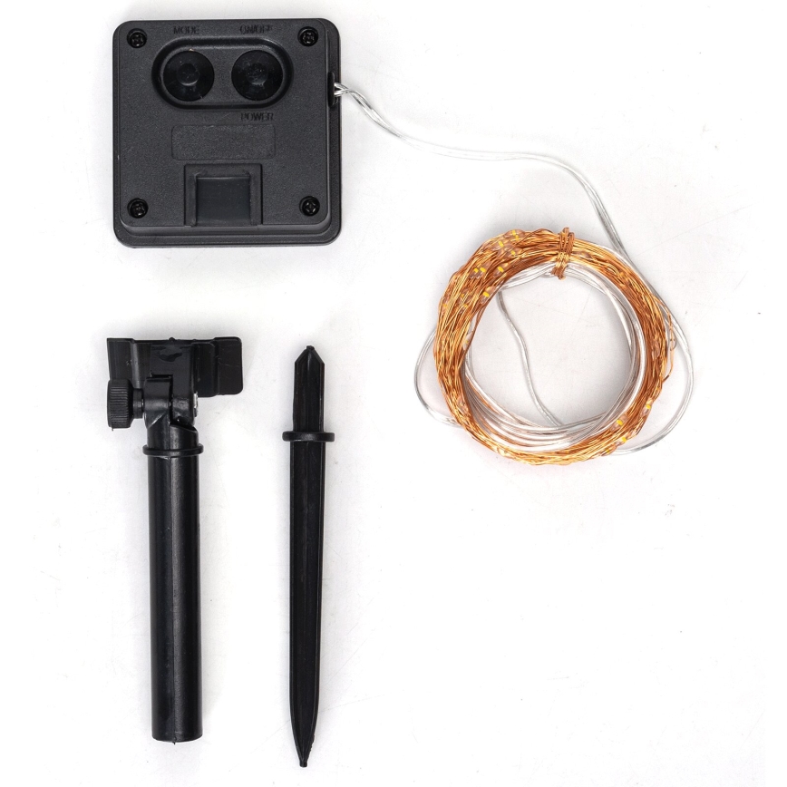 Dva medené drôty sú spojené priehľadnou sklenenou trubicou s vnútorným žltozeleným pásikom na bielom pozadí.