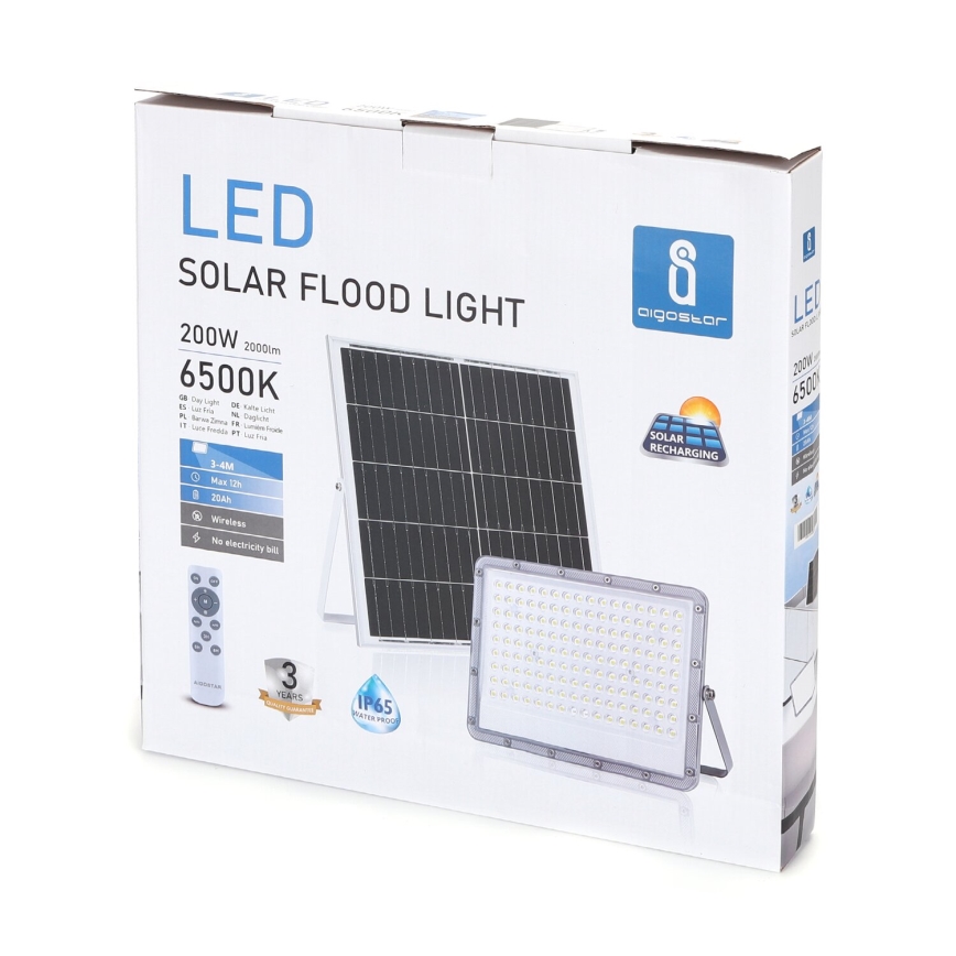 Balenie solárneho LED svetla s výkonom 200W, dosahom 2000lm a farebnou teplotou 6500K. Svetlo je bezdrôtové, s diaľkovým ovládaním a odolnosťou IP65. Balenie zobrazuje svetlo, solárny panel a diaľkový ovládač.
