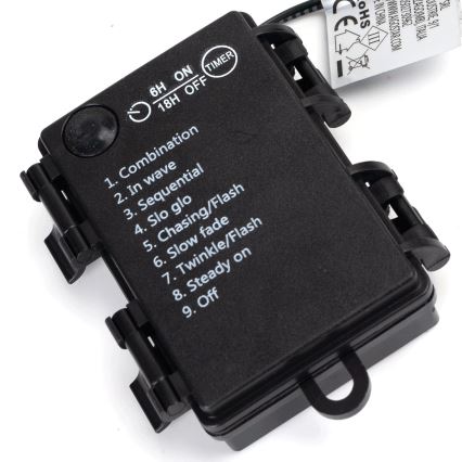 Čierny ovládač svetiel s tlačidlom a textom: 6H ON 18H OFF TIMER; 1. Combination, 2. In wave, 3. Sequential, 4. Slo glo, 5. Chasing/Flash, 6. Slow fade, 7. Twinkle/Flash, 8. Steady on, 9. Off. Ovládač umožňuje nastaviť rôzne svetelné režimy.