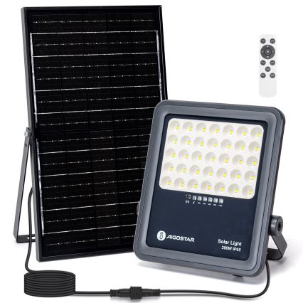Solárny reflektor s 200W svieti. Napája ho pripojený solárny panel. Súčasťou je diaľkové ovládanie. Text na reflektori: AIGOSTAR Solar Light 200W IP65.