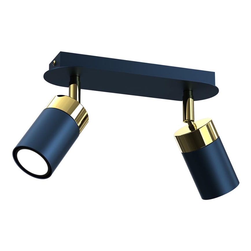 Dvojité nástenné svietidlo s tmavomodrými valcovými tienidlami a zlatými detailami je pripevnené k obdĺžnikovej základni. Svietidlo svieti.