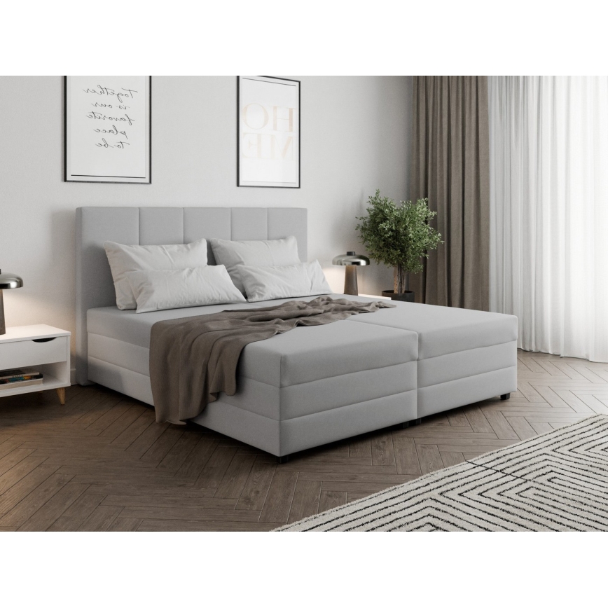 Čalúnená posteľ s pružinovým matracom a úložným priestorom ISABEL 180x200 svetlošedá