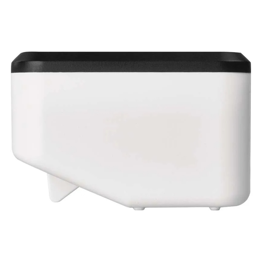 Biely plastový zásobník s čiernym vrchnákom stojí na bielom pozadí. Zásobník má zrezaný tvar a malé nožičky.