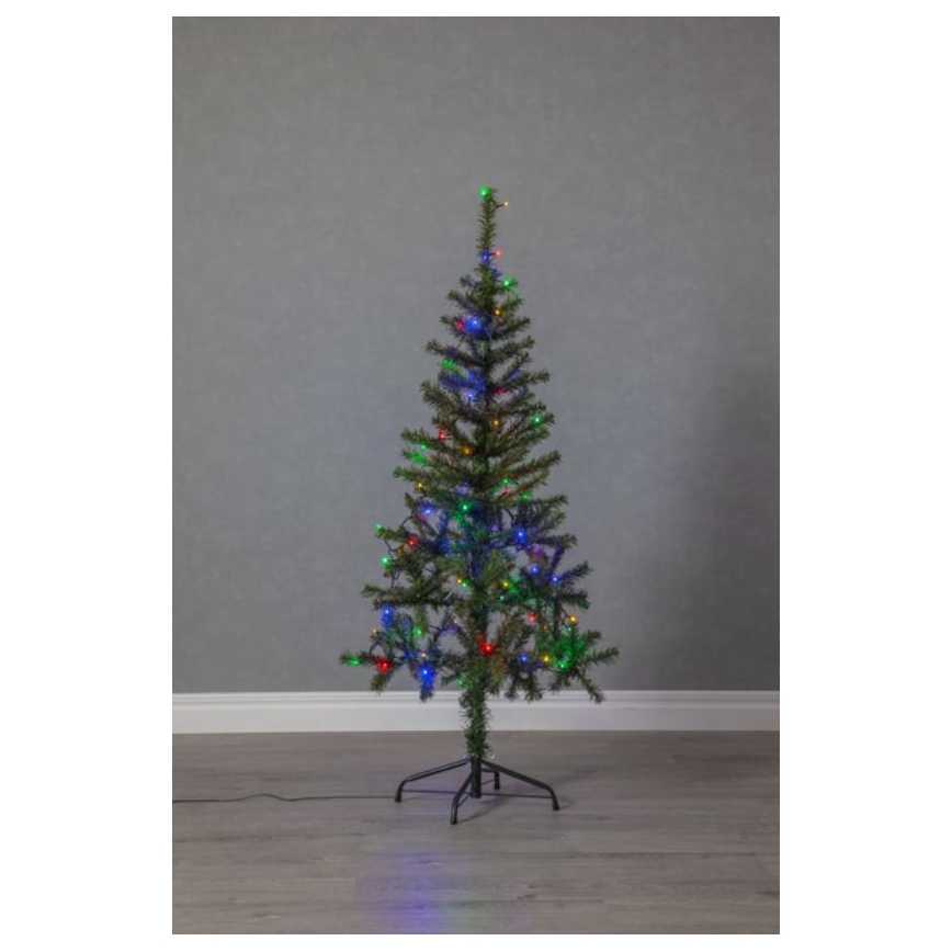 Umelý vianočný stromček s farebnými svetielkami stojí na podlahe pred sivou stenou. Stromček je osvetlený viacfarebnými LED diódami.