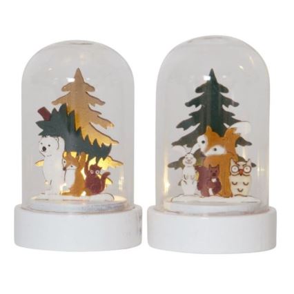 Dve sklenené kupoly s bielym podstavcom obsahujú drevené figúrky zvierat (medveď, líška, zajac, veverička, sova) pod umelými stromčekmi. Vnútorné osvetlenie.