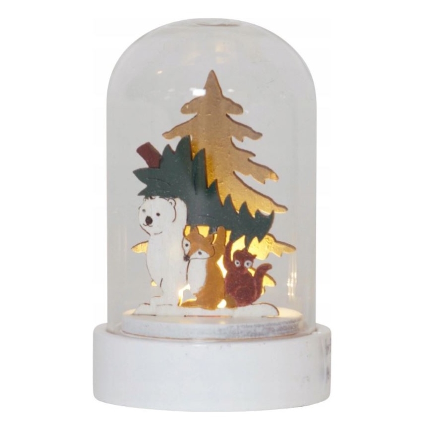 Svetlo s drevenými figúrkami medveďa, líšky a veveričky pod umelým stromčekom v sklenenej kupole na bielej podstavci. Svetlo je vnútri.