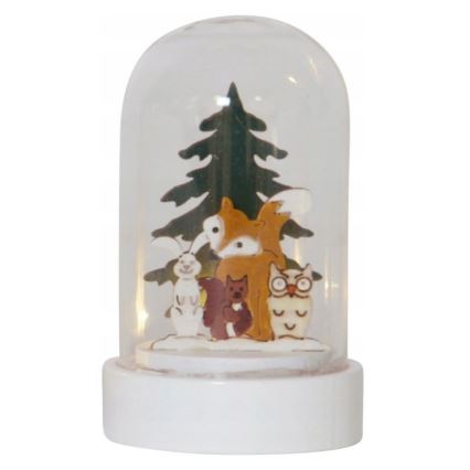 Svietiaca guľa zobrazuje skupinu lesných zvierat – líšku, zajaca, veveričku a sovu – stojacich pred vianočným stromčekom. Celok je umiestnený na bielom podstavci.