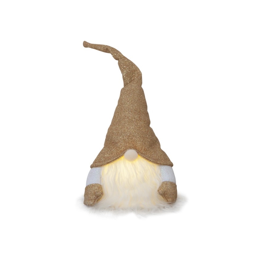 Svietiaci trpaslík s trblietkavým zlatým klobúkom a bielym fúzikom sedí na bielom pozadí. Jeho rukávy sú tiež trblietkavo zlaté. Svetlo vyžaruje z jeho tváre.