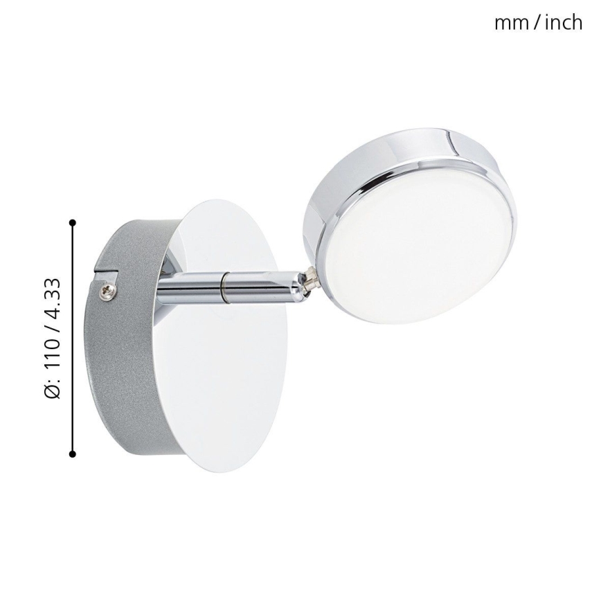 Svietidlo s otočnou hlavicou a okrúhlym tienidlom je pripevnené na stene. Svietidlo má striebornú a chrómovú úpravu. Rozmery: Ø: 110 / 4.33.