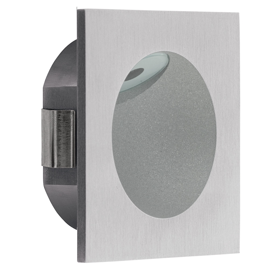 Svietidlo svieti. Štvorcové puzdro zo striebornej ocele obsahuje okrúhly, matný difúzor. Je určené na vonkajšie použitie.