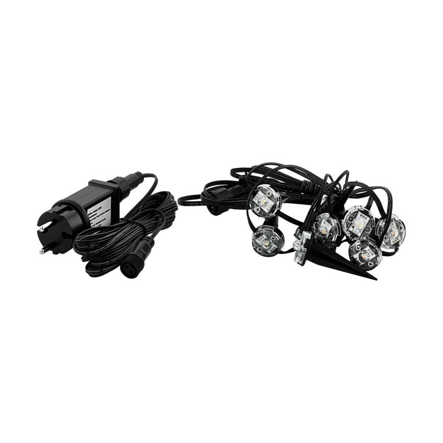 Súprava LED bodových svetiel s transformátorom. Svetelné body s kolíkmi na zapichnutie do zeme sú pripojené k čiernemu káblu. Transformátor má európsku zástrčku.