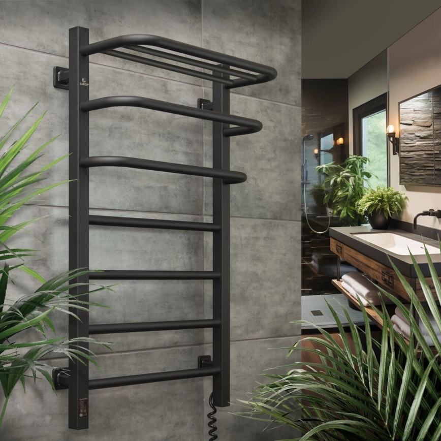 Sušiak na uteráky – je namontovaný na stene v kúpeľni. Nachádza sa v modernom kúpeľňovom priestore s rastlinami.