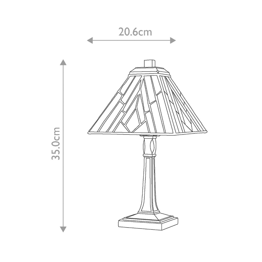 Stolová lampa s geometricky zdobeným tienidlom stojí na štvorcovej podstave. Výška lampy je 35 cm, šírka tienidla 20,6 cm.