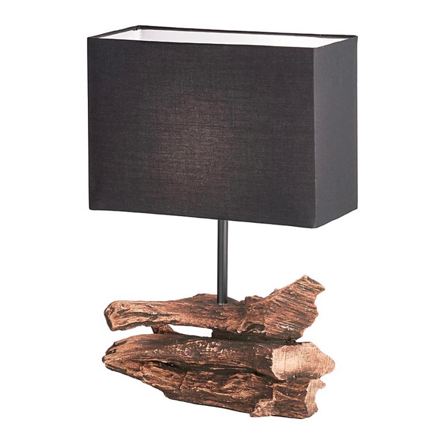 Stolová lampa s čiernym obdĺžnikovým tienidlom stojí na podstavci imitujúcom niekoľko kusov dreva v hnedo-meďovej farbe. Lampa je umiestnená na bielom pozadí.