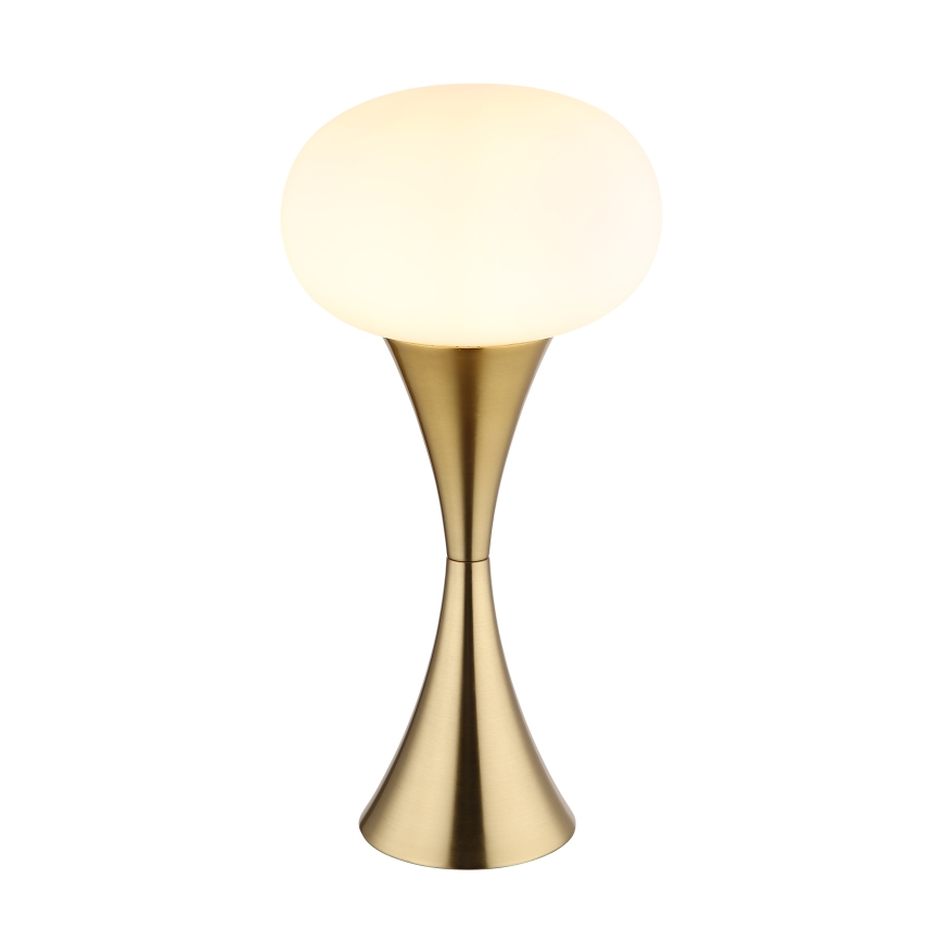 Stolová lampa svieti. Má guľovitý biely tienidlo a zlatý kovový podstavec tvaru presýpacích hodín. Stojí na bielom pozadí.