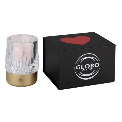 Svietidlo s ružovým kremeňom svieti. Je umiestnené v sklenenej nádobe na zlatom podstavci s vypínačom. Balenie je čierna krabička s červeným srdcom a logom GLOBO LIGHTING.