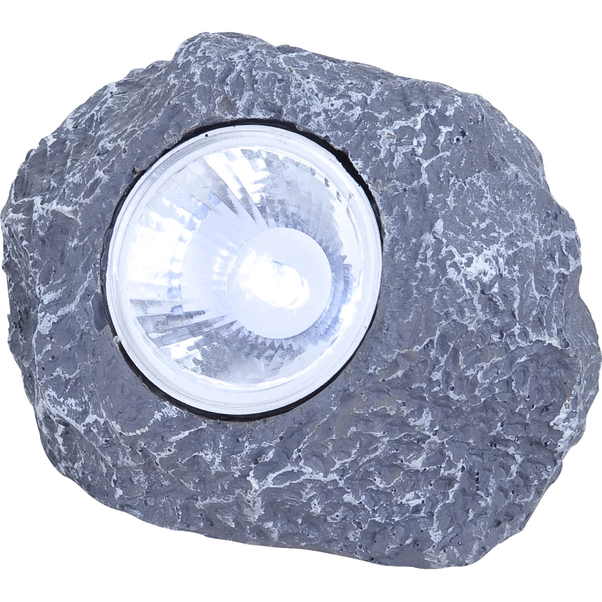 Svetlo v tvare kameňa svieti. Je sivé a imituje štruktúru prírodného kameňa. Svetlo je umiestnené v jeho vnútri.