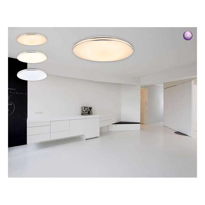 LED stropné svietidlo svieti v modernej, svetlej miestnosti s bielym nábytkom. Tri menšie svietidlá sú zobrazené v rôznych veľkostiach.