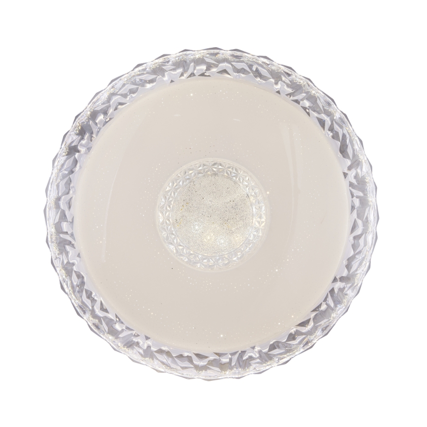 Svetlo s okrúhlym tienidlom, ktoré je vyrobené z priesvitného materiálu s fasetovaným okrajom, má v strede menší, jemne mliečne zafarbený, kryštálikmi posiaty disk. Celé tienidlo je svetlohnedo-biele.