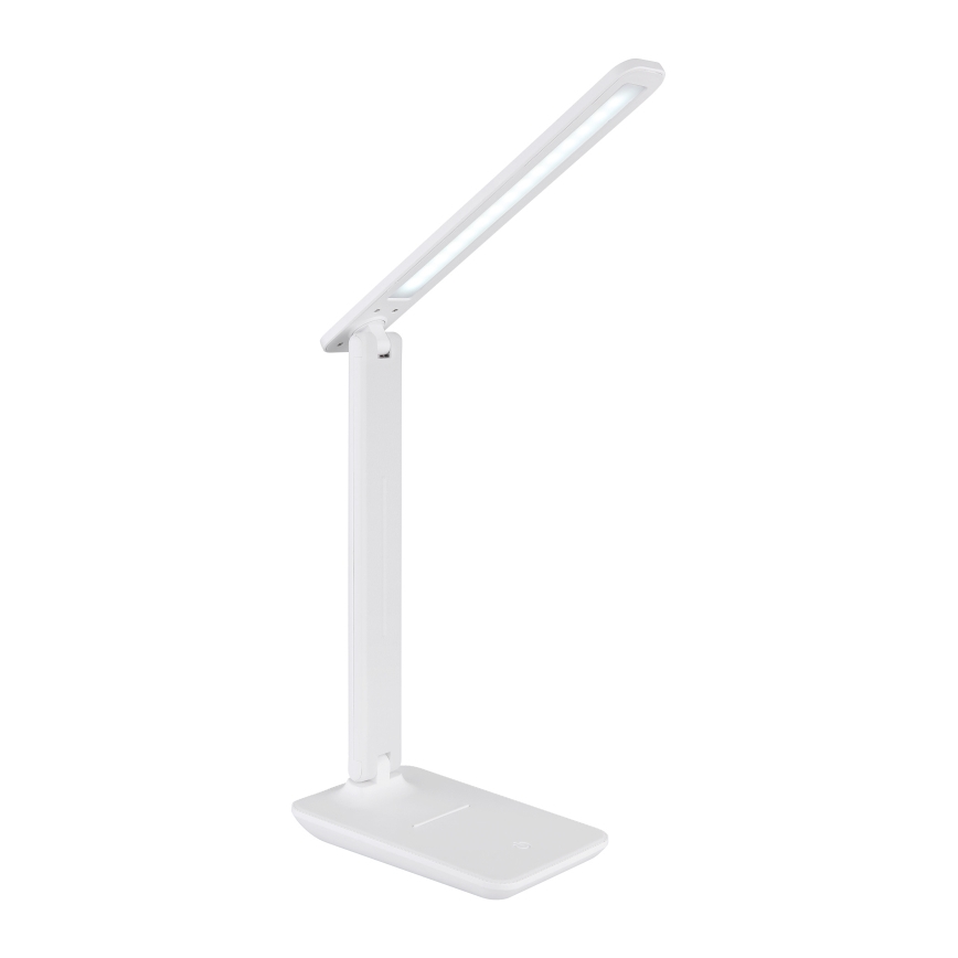 Biela stolná lampa s LED osvetlením je umiestnená na bielom pozadí. Lampa je zložená a pripravená na použitie. Je to kompaktná lampa s nastaviteľným ramenom.