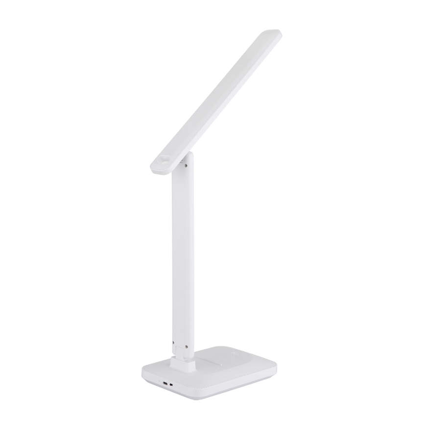 Biela stolová lampa je zložená, s dlhým ramenom smerujúcim nahor a štvorcovou základňou. Na spodnej strane základne je viditeľný USB port. Lampa stojí na bielom pozadí.