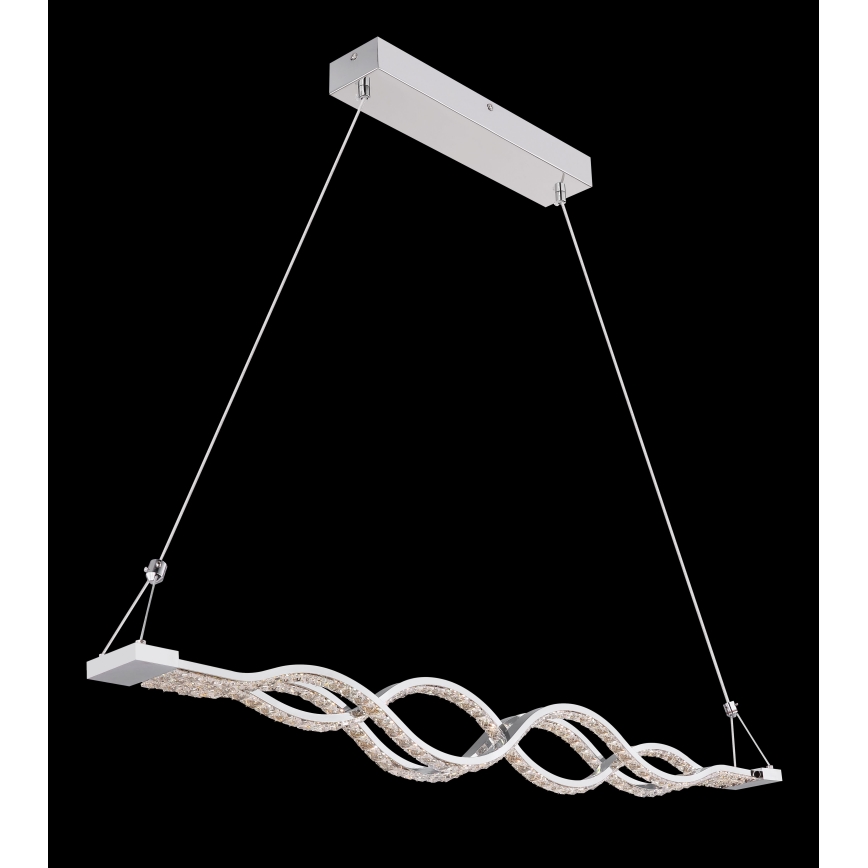 Svietidlo visí zo stropu na dvoch kábloch. Jeho telo je v tvare dvoch prepletených vĺn, osadených kryštálmi. Svietidlo je striebornej farby.
