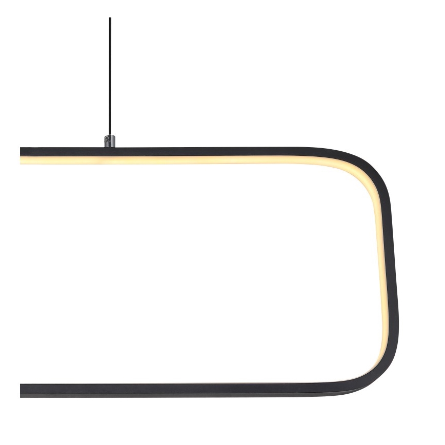 Svietidlo visí zo stropu. Je obdĺžnikového tvaru s jemne zaoblenými rohmi, čiernej farby s vnútorným svetlým LED osvetlením.