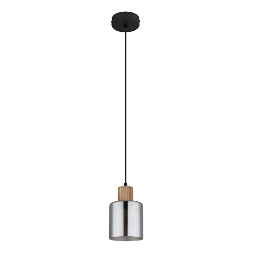 Závesné svietidlo visí zo stropu na čiernom kábli. Svietidlo má valcový kovový tienidlo striebornej farby a drevený prvok v strednej časti. Horná časť je čierna.