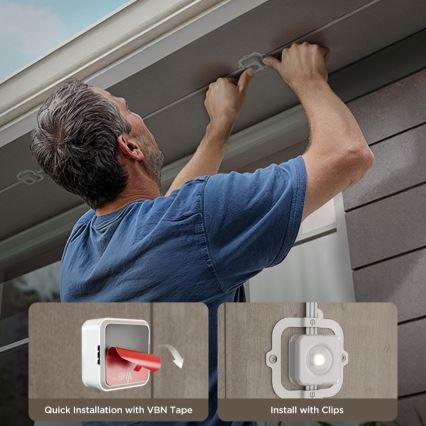 Muž montuje malú bielu skrinku pod strechu domu. Používa lepiacu pásku alebo spony. Text pod obrázkom uvádza: Quick Installation with VBN Tape a Install with Clips.