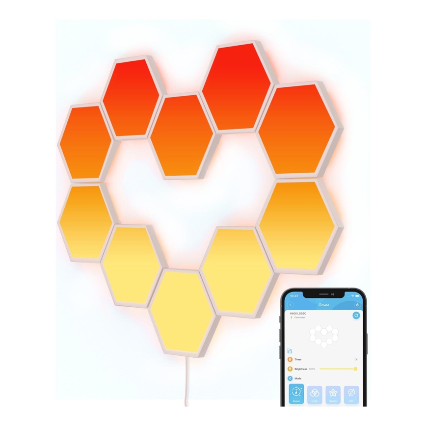 Hexagonálne LED svetlá s prechodom farieb od oranžovej po žltú sú pripevnené na stene v tvare srdca. Svetlá sa ovládajú cez mobilnú aplikáciu Govee, zobrazenú na obrazovke smartfónu. Aplikácia ukazuje nastavenia jasu, režimov a farieb.