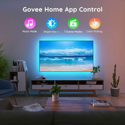 LED pásik svieti pod televízorom zobrazujúcim morskú scenériu v obývacej izbe. Ovládanie cez aplikáciu Govee Home App umožňuje nastaviť režimy: hudobný, jas, 7 scén a výber farieb.