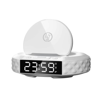 Biela budík zobrazuje čas 23:59. Má integrovanú bezdrôtovú nabíjaciu plochu a tlačidlo SNOOZE. Je umiestnený na bielom pozadí.