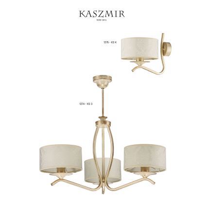 Trojramenný zlatý luster s textilnými tienidlami visí. K nemu patrí aj jednoramenná nástenná lampa s podobným tienidlom. Kódy produktov: 1274 - KS 3 a 1275 - KS K. Značka Kaszmir.