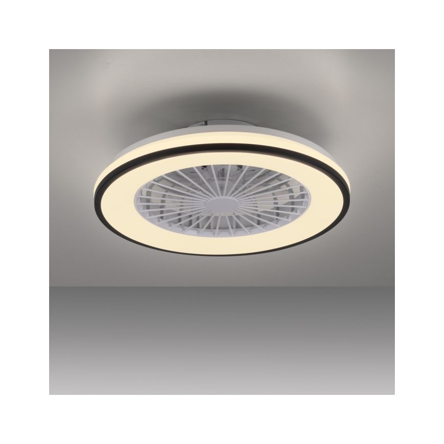 Stropný ventilátor s osvetlením je pripevnený k stropu. Ventilátor má biele lopatkya je obklopený kruhovým svetelným prstencom. Celok je v bielom a tmavosivom prevedení.