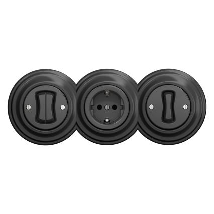 Tri čierne elektroinštalačné prvky sú zoradené vedľa seba: dva vypínače a jedna zásuvka. Všetky sú umiestnené na bielom pozadí.