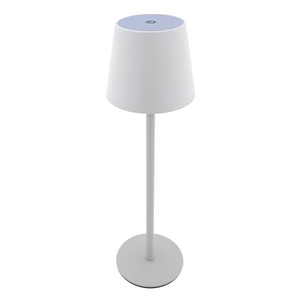 Biela stolná lampa s kužeľovitým tienidlom a tenkým stĺpikom stojí na kruhovej základni. Vrch tienidla má svetlomodrý vrch s tlačidlom. Lampa je umiestnená na bielom pozadí.