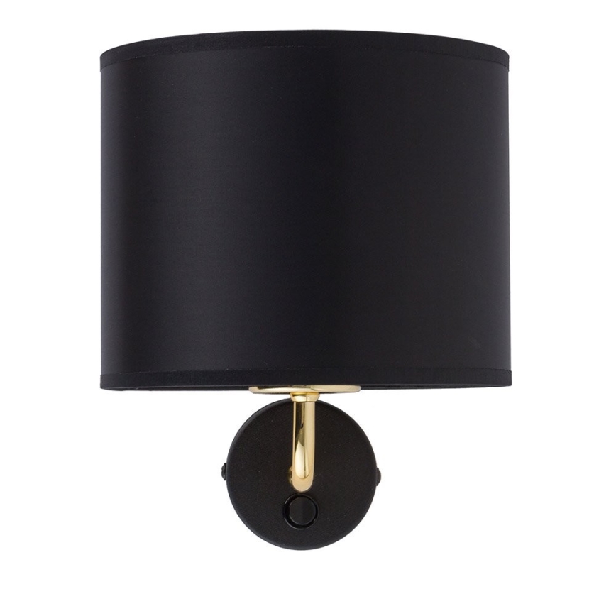 Nástenná lampa s čiernym cylindrickým tienidlom a zlatým ramenom je pripevnená na stenu. Svietidlo má čiernu základňu s vypínačom.