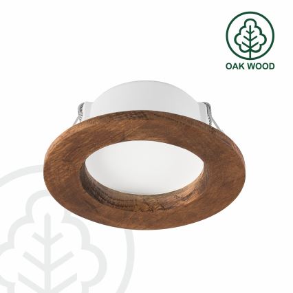 Svietidlo s bielym vnútorným difúzorom je vsadené do tmavohnedého dubového rámu. Svietidlo je pripravené na montáž. Text na obrázku: OAK WOOD.