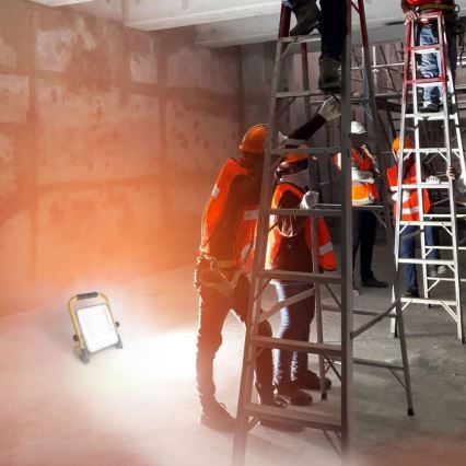 LED reflektor so stojanom LED/100W/230V 4500K IP65 oranžový