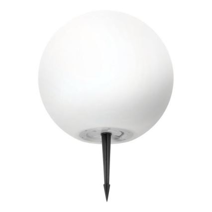 Biela guľová lampa je umiestnená na čiernom kovovom kolíku, ktorý slúži na zapichnutie do zeme. Lampa je zrejme určená pre vonkajšie použitie.