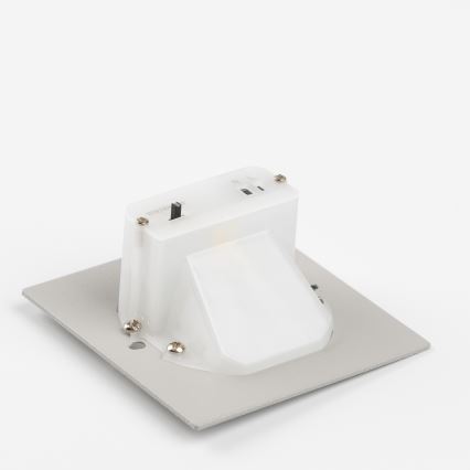 Svietidlo je namontované na štvorcovej kovovej platni. Svietidlo je biele a má sklopný kryt. Na hornej strane je viditeľný vypínač s nápisom „ON/OFF“.