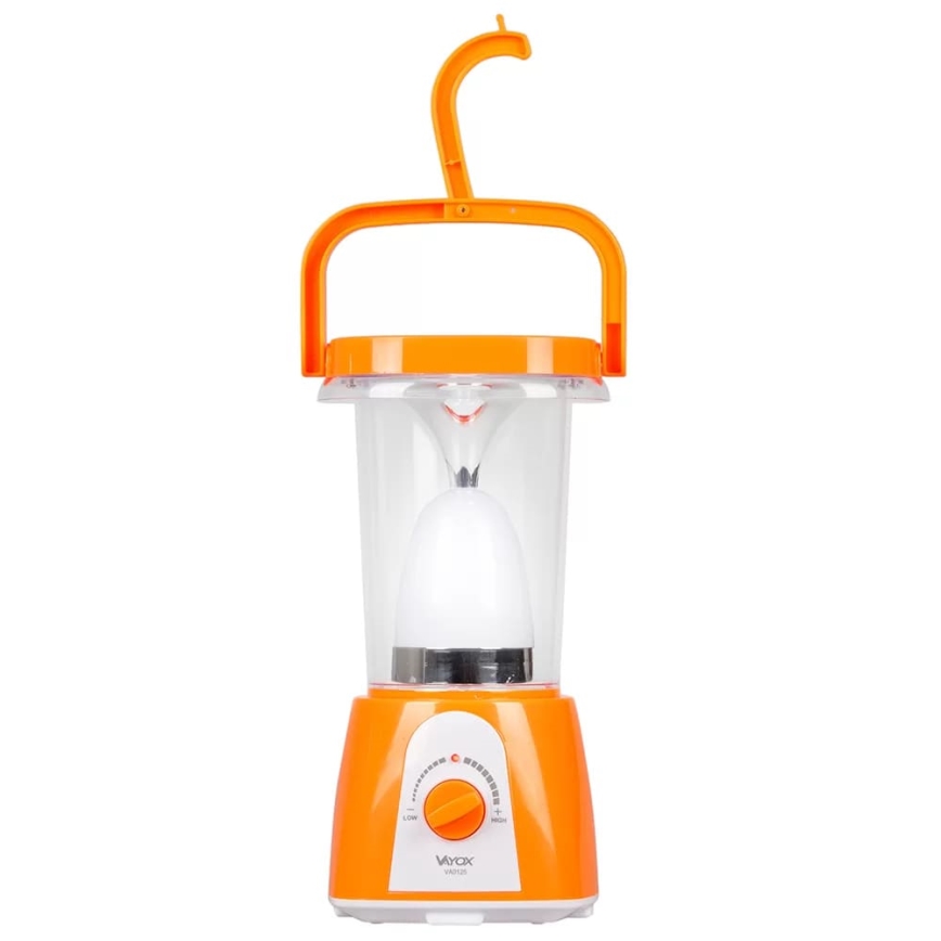 Oranžová prenosná lampa s plastovým telom a úchytom svieti. Má otočný prepínač s označením „LOW“ a „HIGH“. Na spodku je nápis „Vyvox VARIOX“.