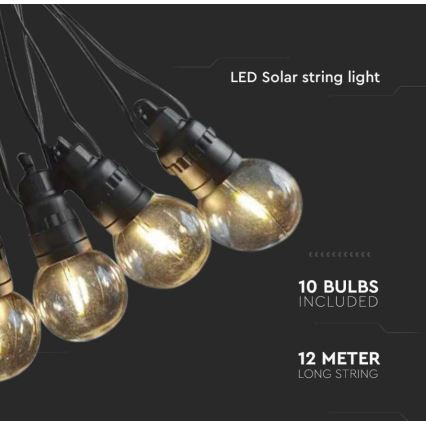 LED solárne svetelné reťazové osvetlenie s desiatimi guľatými žiarovkami v teplom svetle. Dĺžka reťaze je 12 metrov. Svietidlá sú pripojené k čiernemu káblu.