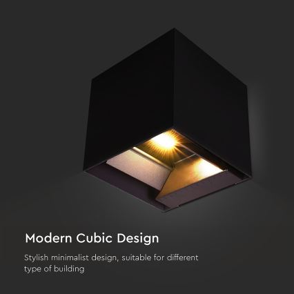 Kubická nástenná lampa svieti. Je čierna, s vnútorným zlatým prvkom. Text: Modern Cubic Design. Štýlový minimalistický dizajn, vhodný pre rôzne typy budov.