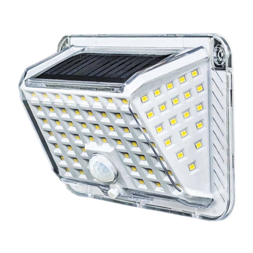 Solárny LED senzorový reflektor svieti. Obsahuje solárny panel a množstvo LED diód. Je umiestnený na stene.