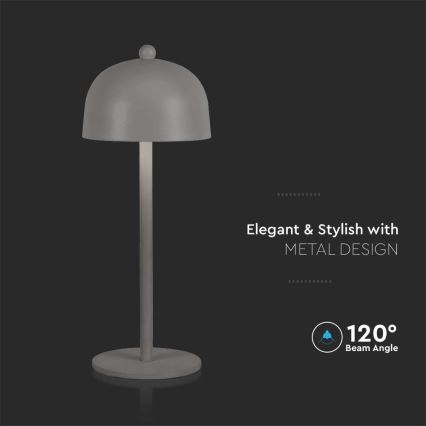 Stolová lampa s kupolovitým tienidlom stojí na tmavom podklade. Lampa je svetlosivá s vysokou, tenkou kovovou nohou. Text na obrázku: „Elegant & Stylish with METAL DESIGN“ a „120° Beam Angle“.