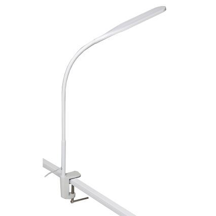 Biela stolová lampa s flexibilným ramenom a svorkou je pripevnená k plochej lište. Lampa svieti.