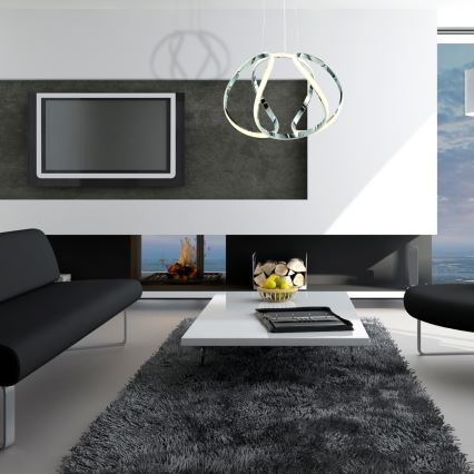 Svietidlo visí zo stropu. Skladá sa z troch prepletených chrómových kruhov s integrovaným LED osvetlením. Svetlo je teplej bielej farby.