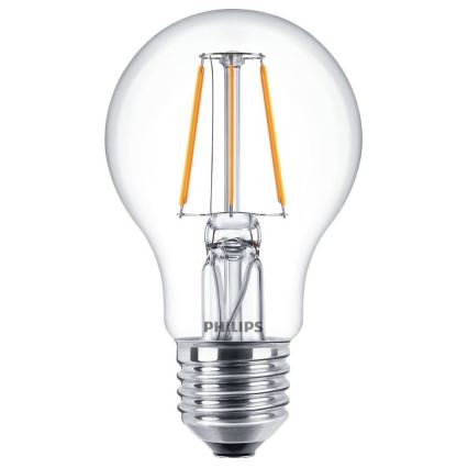 LED žiarovka Philips svieti. Má sklenenú banku a špirálovité LED diódy vo vnútri. Je na bielom pozadí.